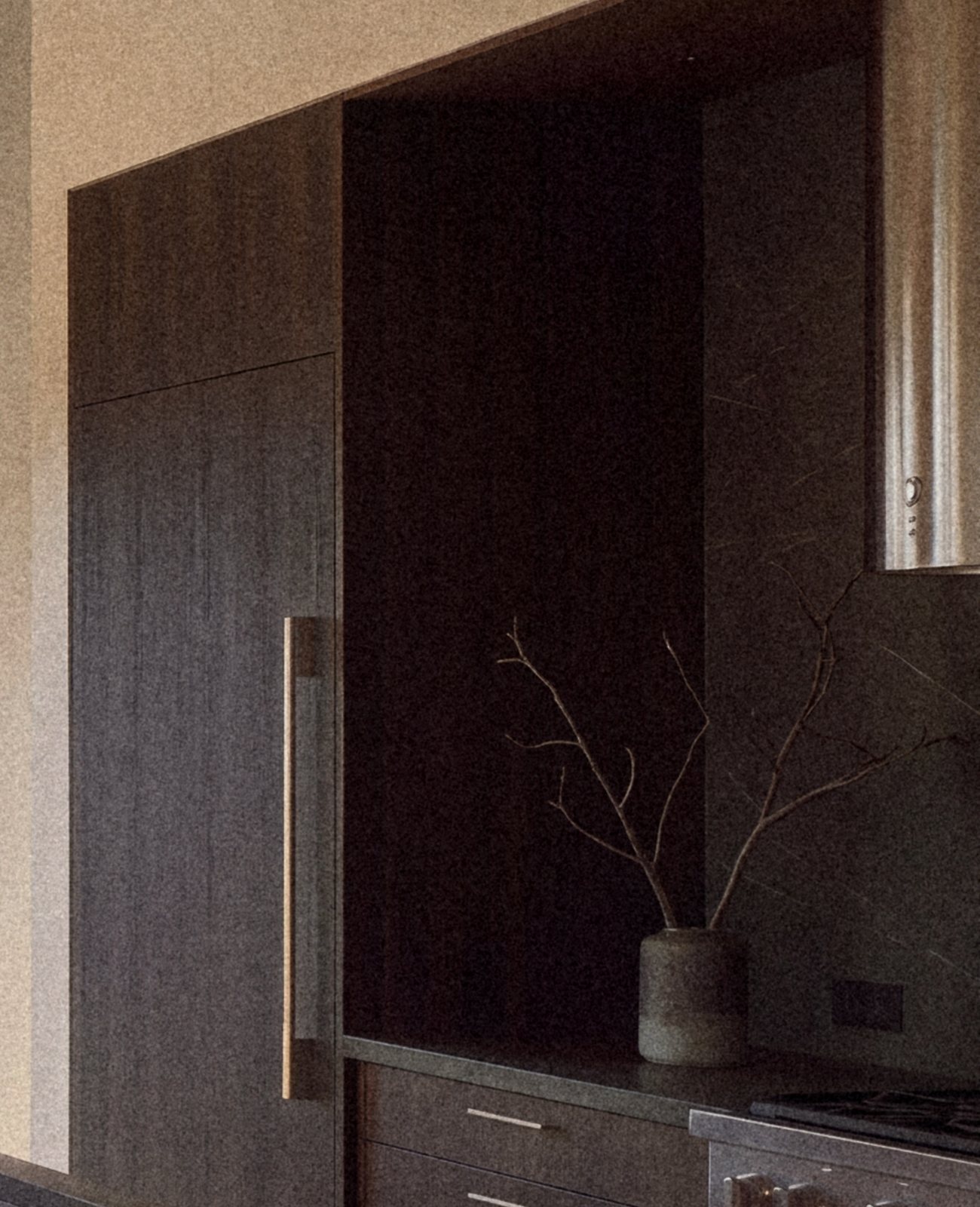 Rendering of dark timber cabinetry with an open niche beside the range